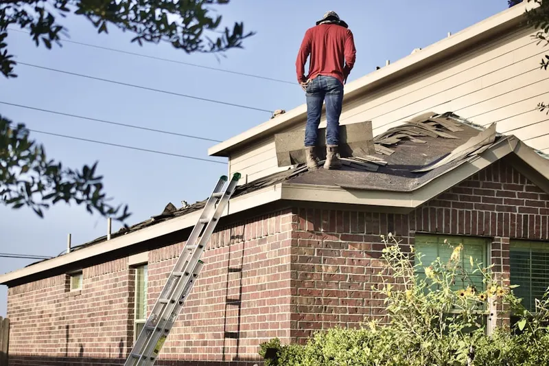 Professional roofer working on a residential roof in Pascagoula